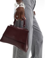 PASQ mini curved bottom grab bag with cross body strap in burgundy