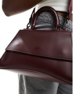 PASQ mini curved bottom grab bag with cross body strap in burgundy