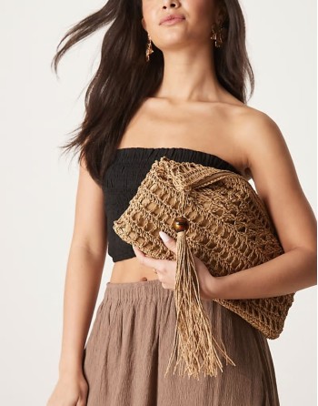 straw clutch bag with open weave and tassel and bead detail