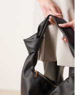 knotted strap shoulder bag in black