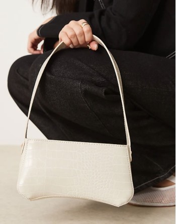 textured curved based shoulder bag in stone
