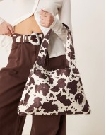tapered shoulder bag in cow print