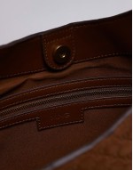 embossed monogram leather bag in brown