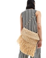 oversized straw clutch with fringe detail in natural